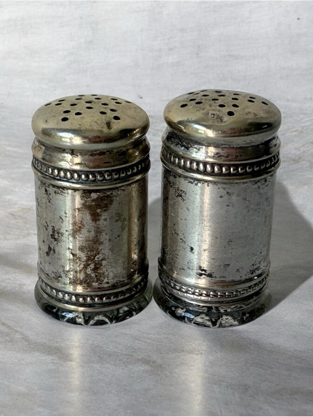 pair of antique EPNS silver salt and pepper shakers
